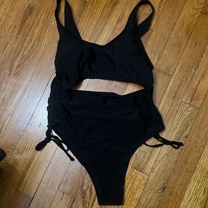 Black drawstring bathing suit.